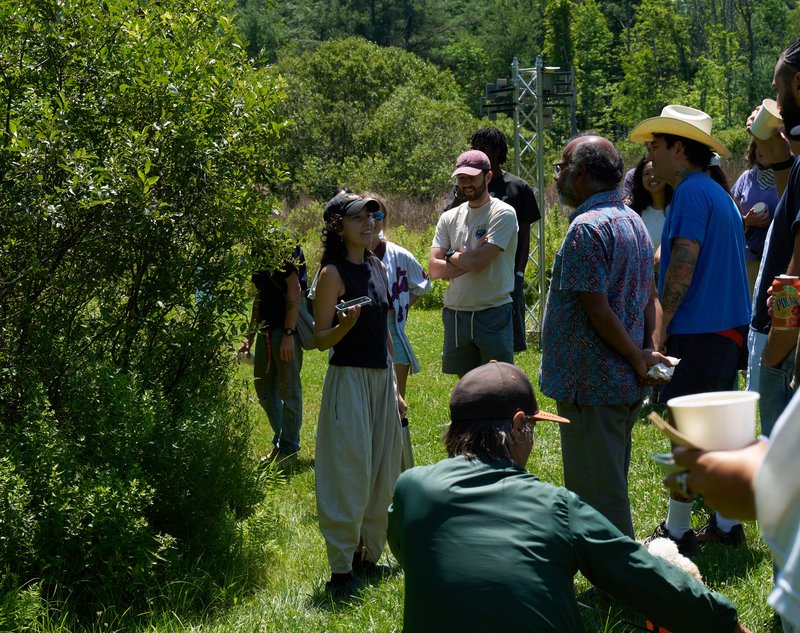 Bianca Felix Biberaj speaking with a group outdoors at Wave Farm